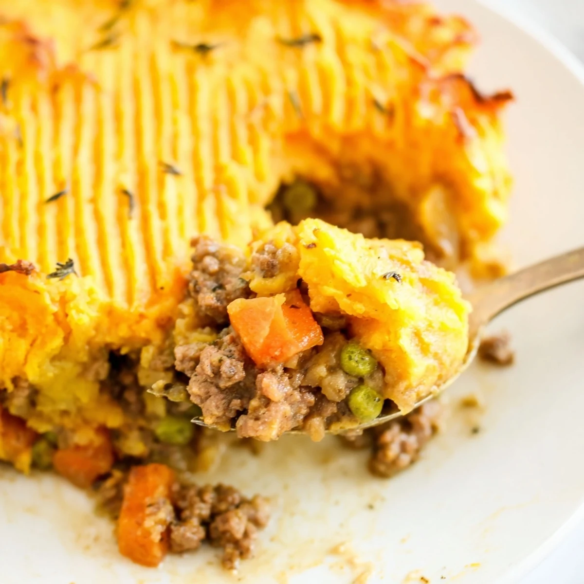 Hearty Beef Shepherds Pie with Sweet Potato features a savory beef filling and creamy mash, perfect for a comforting meal.
