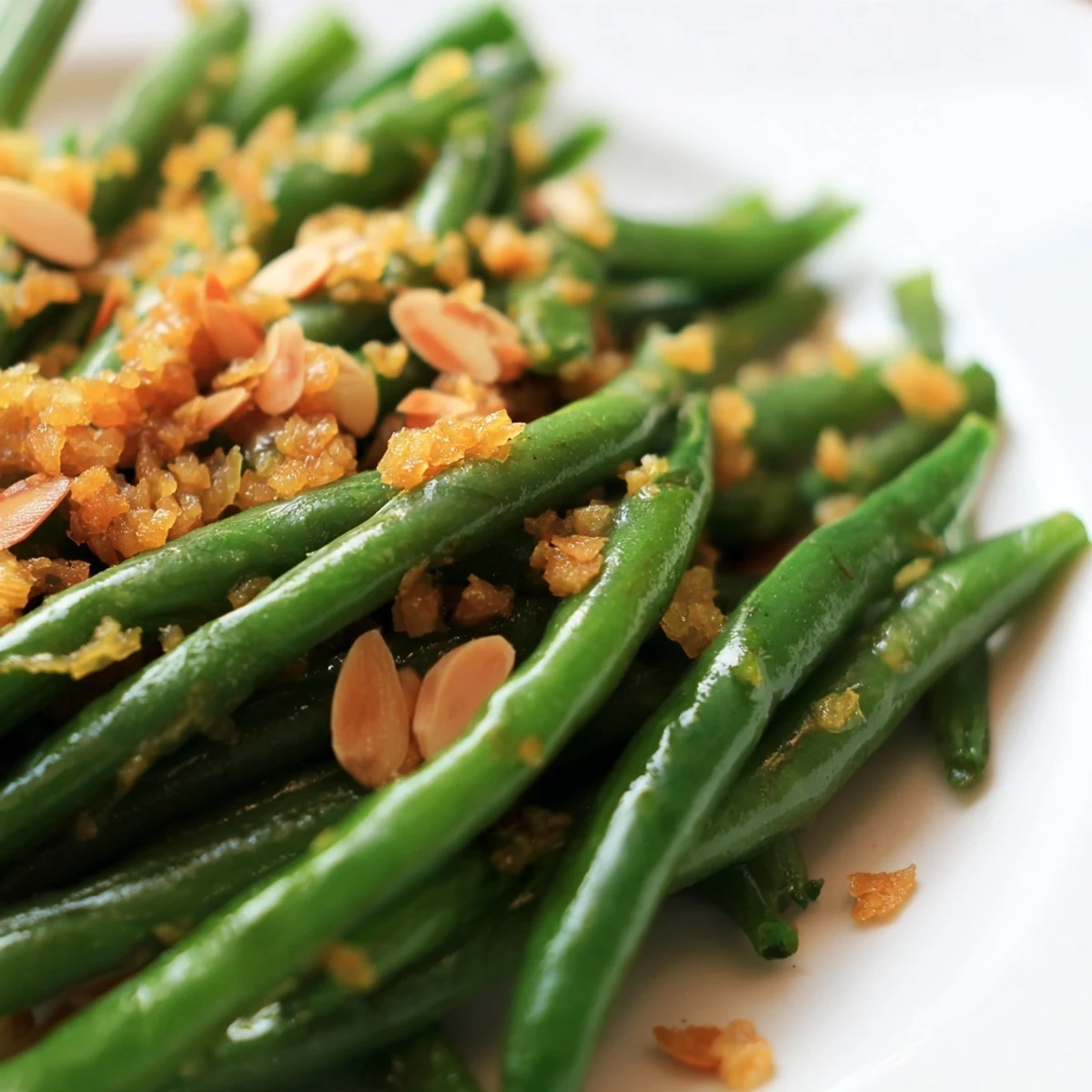 Fresh green beans, vibrant lemon, and garlic sauté, finished with toasted almonds for a gluten-free side.
