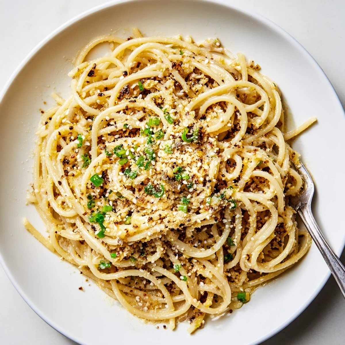 Quick Garlic Noodles served as a main course with chopsticks ready for a savory vegetarian dinner.