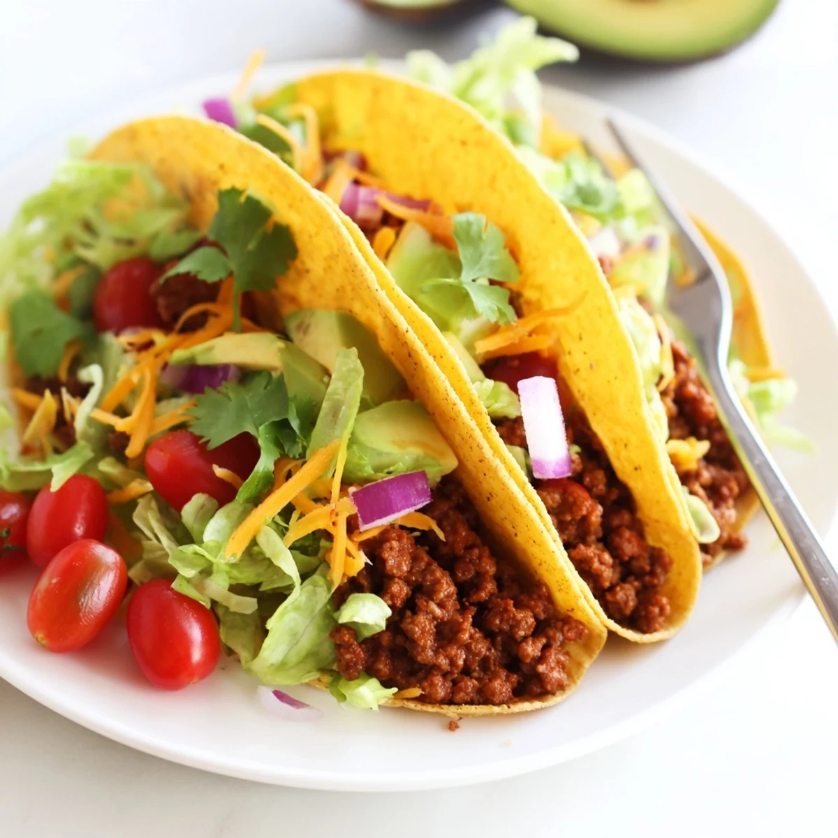 Sizzling vegetarian ground beef mixture being spooned into soft taco shells for a quick weeknight meal.