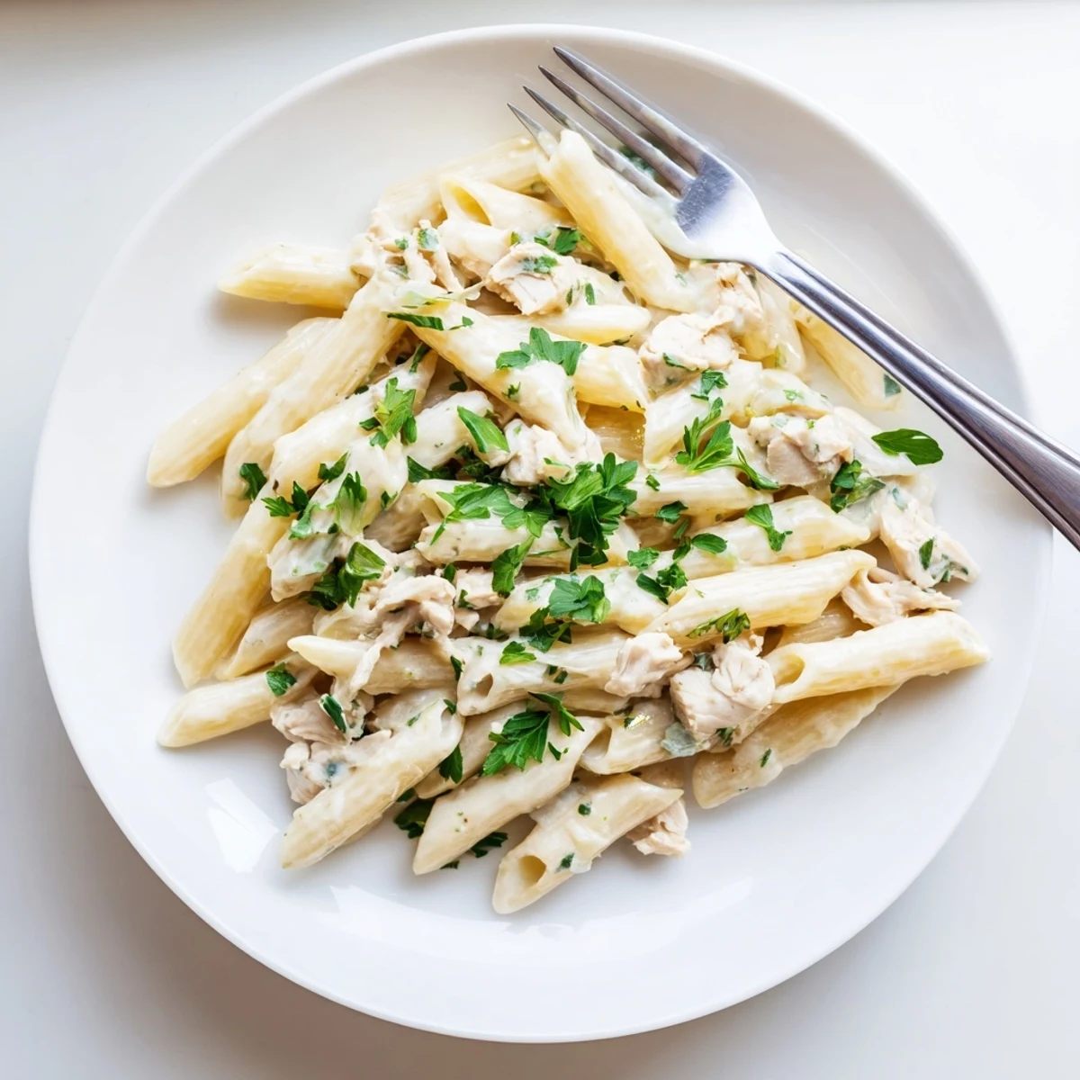 Savory garlic and Parmesan blend into velvety cream in this comforting Crockpot Garlic Parmesan Chicken Pasta.