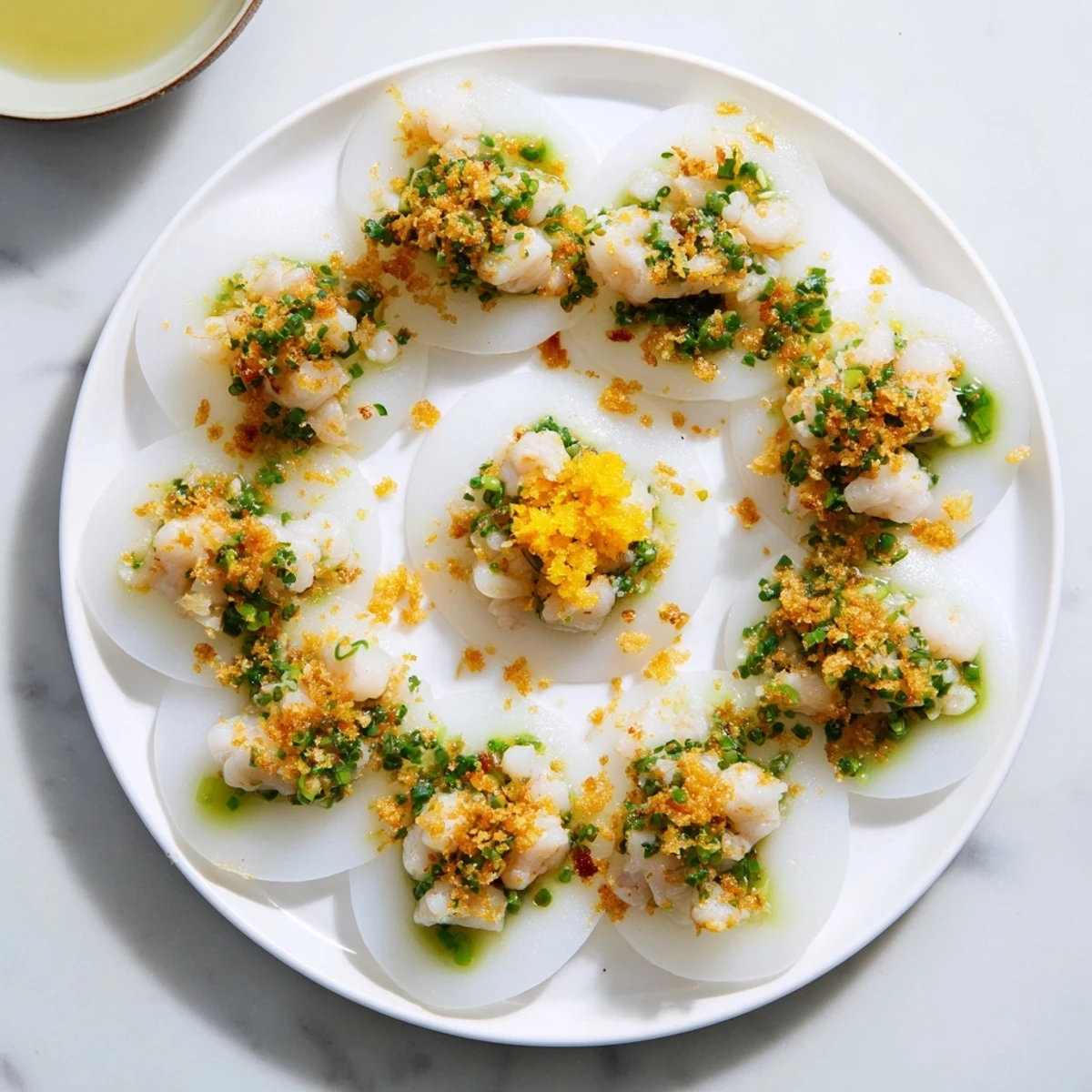 Gluten-free Banh Beo served warm with savory dried shrimp topping and tangy lime fish sauce dipping sauce
