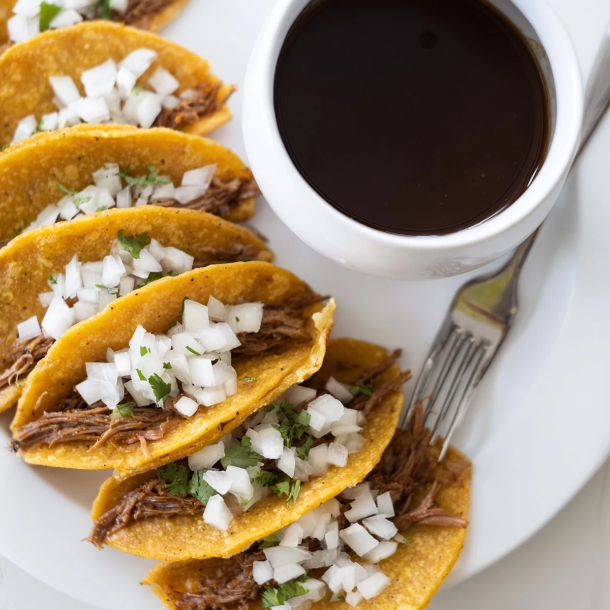 Golden super crispy birria tacos filled with melted cheese and tender shredded beef