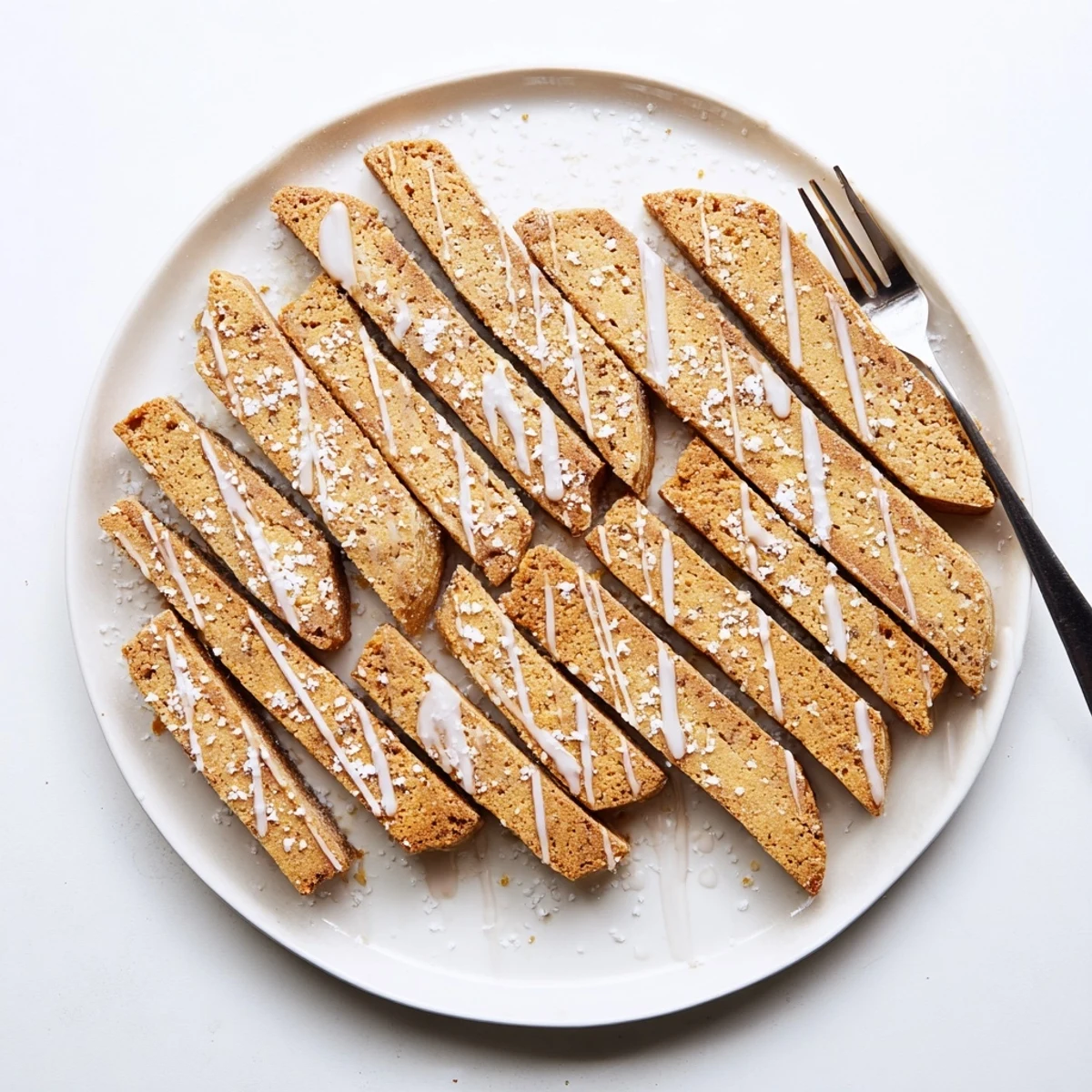 Buttery sugar cookie biscotti pieces ready for dipping into a steaming cup of coffee