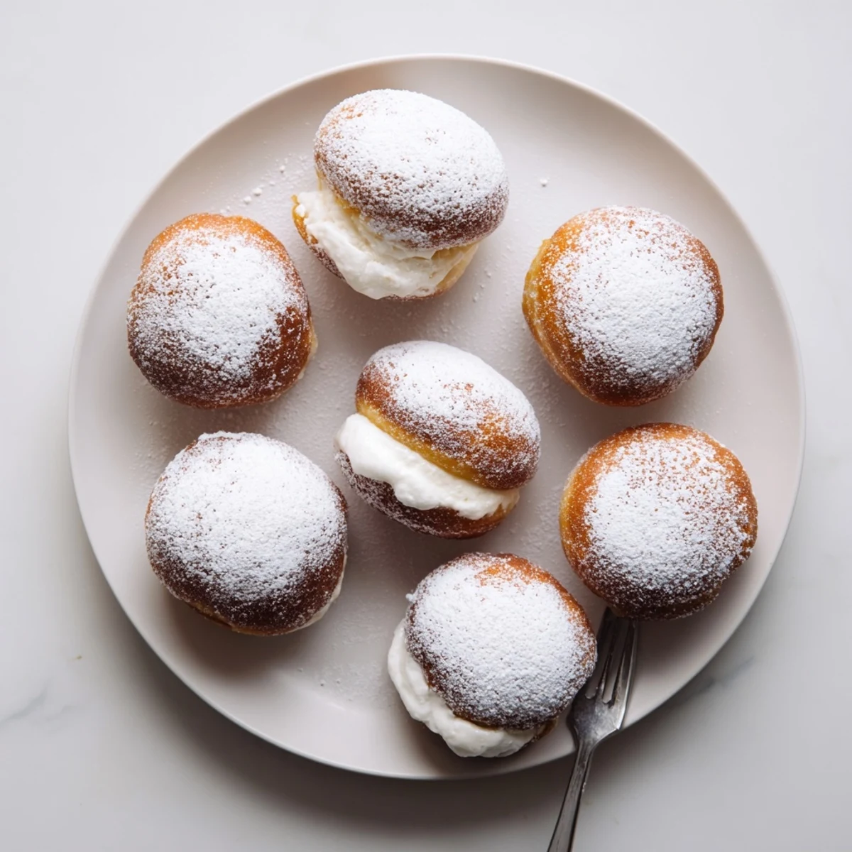 Close-up of soft Korean donuts with creamy milk filling and sugar coating