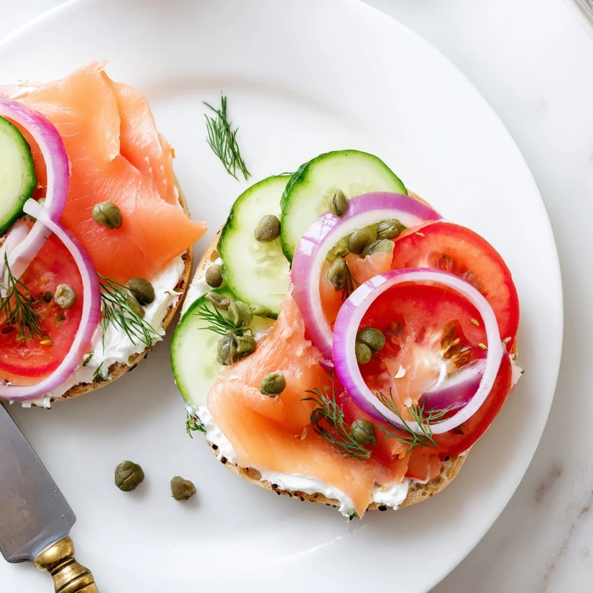 Toasted bagel sandwich piled high with smoked salmon and creamy cheese spread