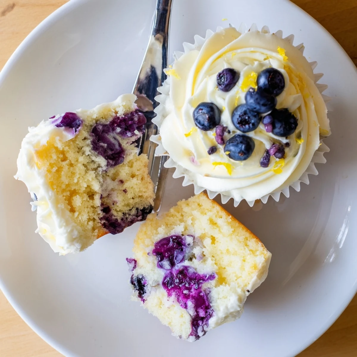 Light and fluffy lemon blueberry cupcakes bursting with fresh berries and zesty citrus