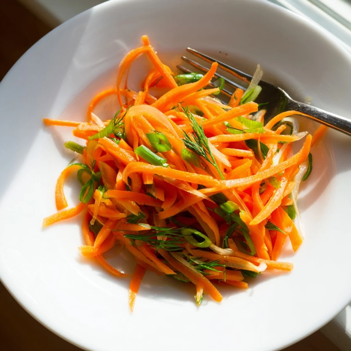 Marinated Lemon Dill Carrot Salad featuring vibrant orange carrots tossed with fresh herbs