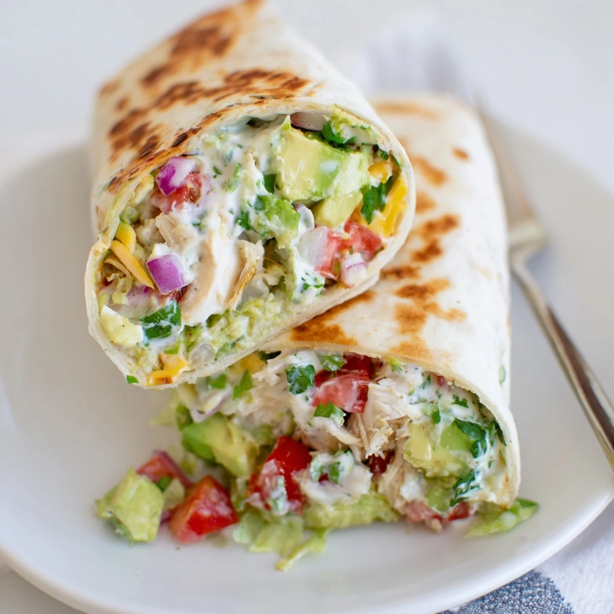 Warm Chicken Avocado Ranch Burritos crisped on skillet, tender chicken and ranch