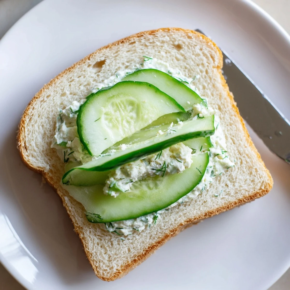 Tea-ready Classic Cucumber Sandwiches cut into triangles, soft white bread.