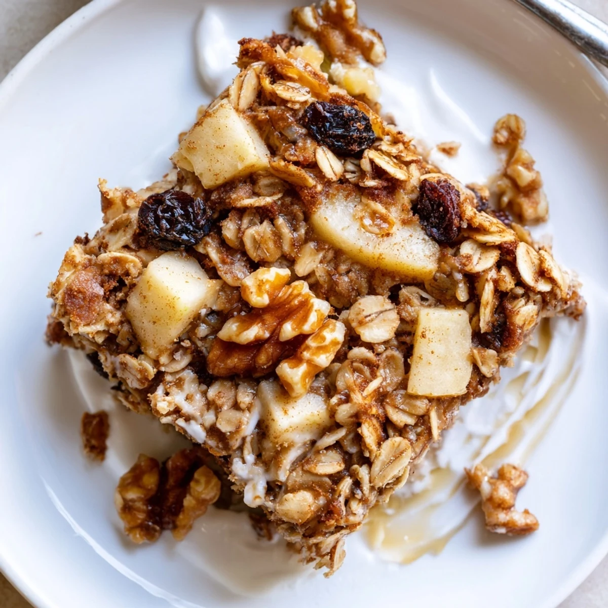 Comforting Delicious Apple Cinnamon Oatmeal Bake Recipe For Mornings, served warm with yogurt