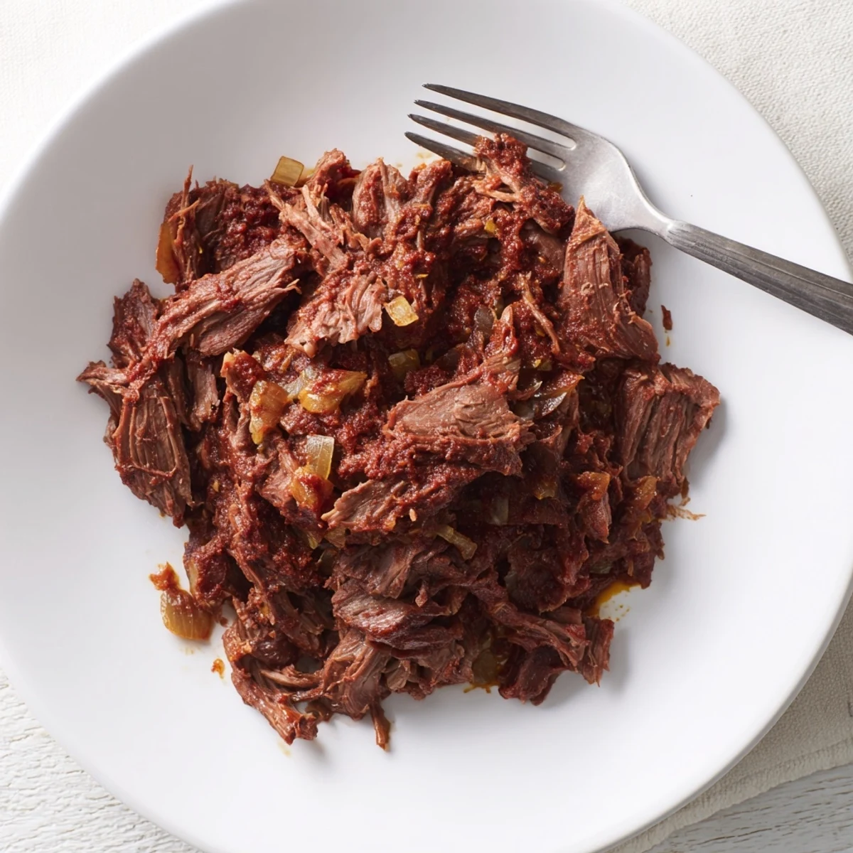 Juicy beef barbacoa slow-cooked with chipotle peppers and Mexican spices for tacos